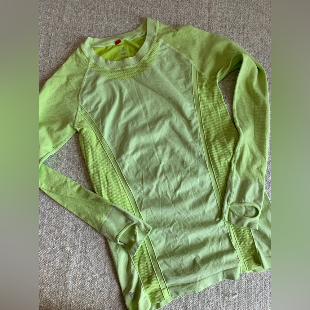 Ellie workout top lime green with thumb holes.